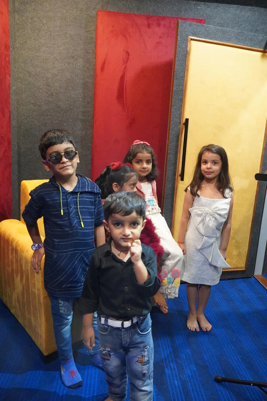 Portrait of young CloudStudio108 music academy students inside the recording room
