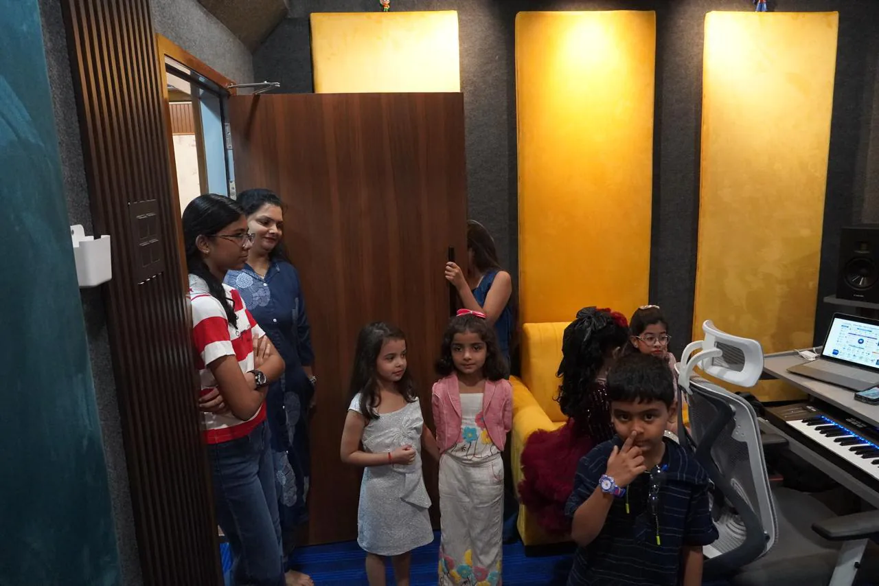 Young academy students and their families gathered inside the CloudStudio108 control room