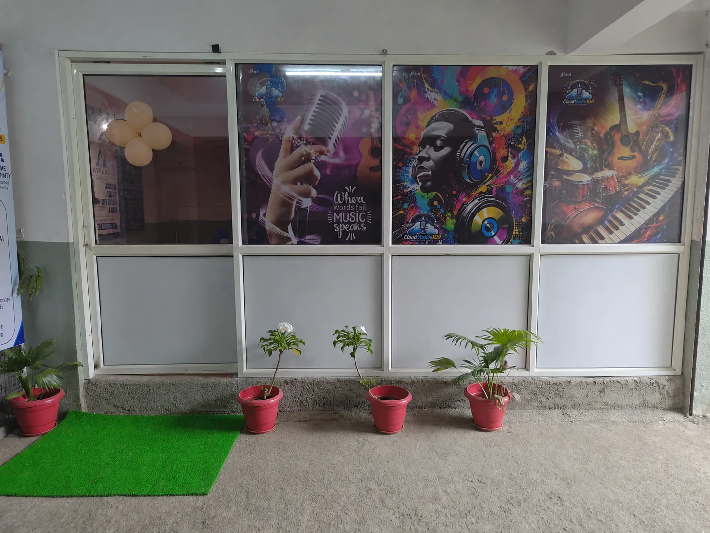 CloudStudio108 branded wall art at the studio entrance