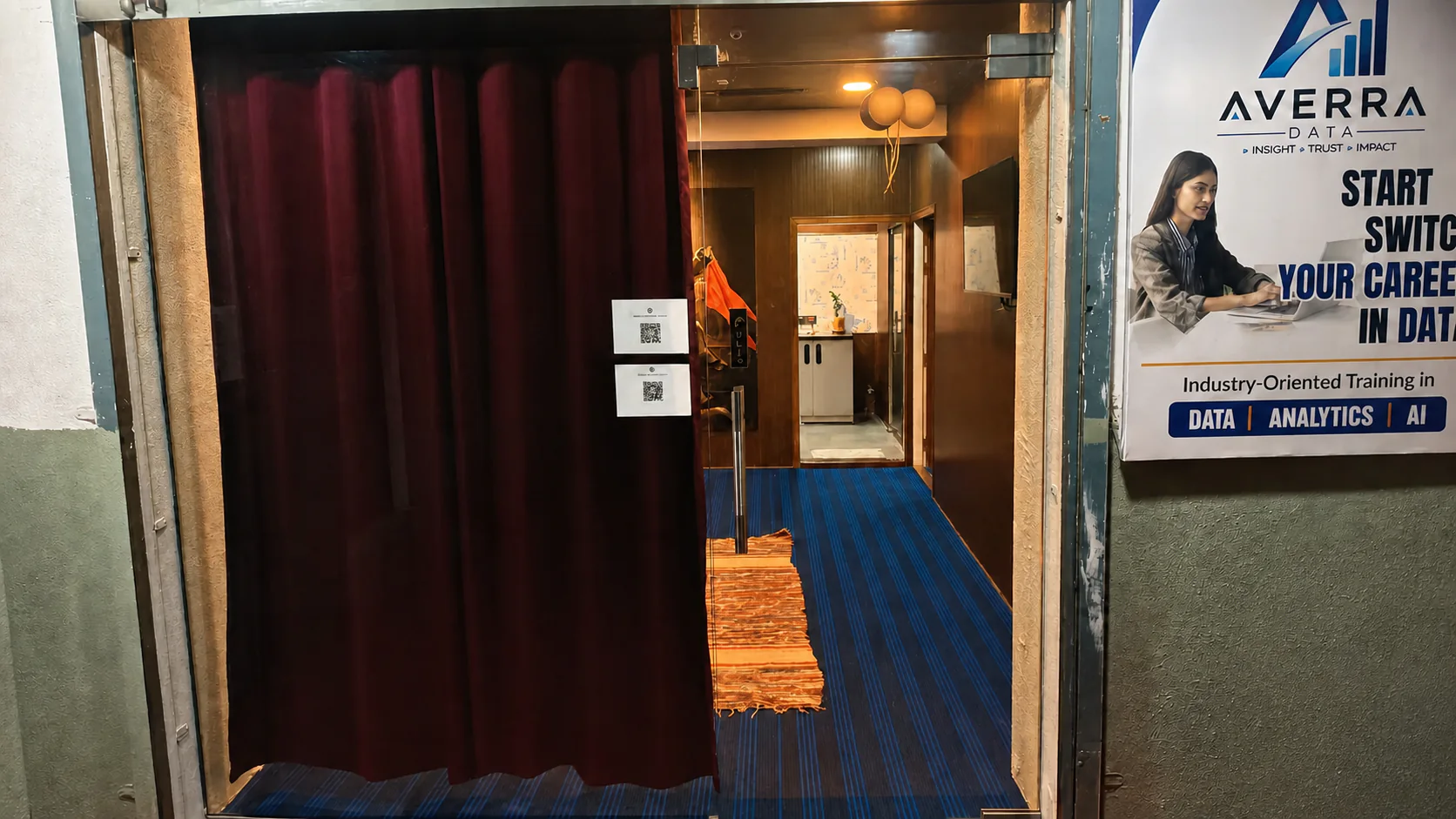Enhanced wide exterior view through the CloudStudio108 glass entrance and corridor