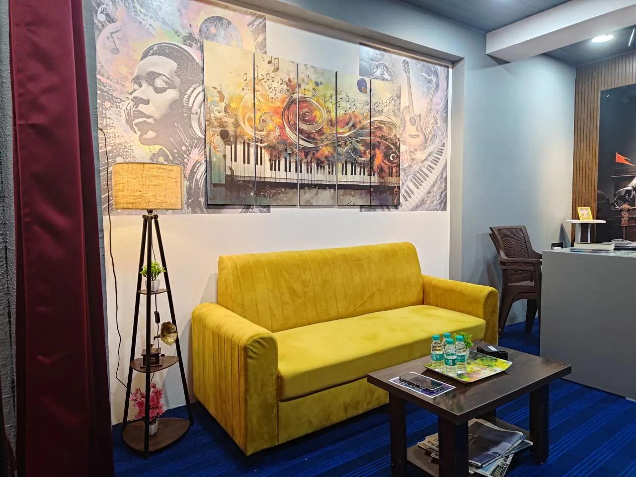 Close angled view of the CloudStudio108 lounge, artwork, seating, and reception desk