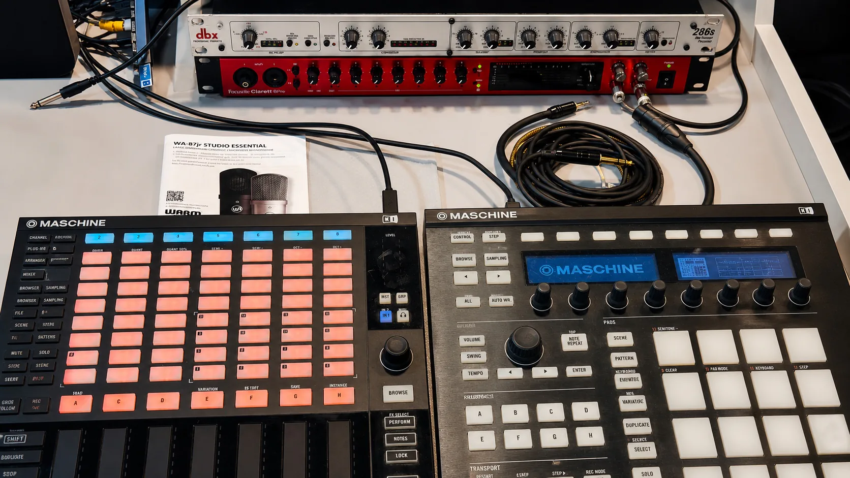 Enhanced landscape close-up of studio preamps, audio interface, cables, and Maschine controllers
