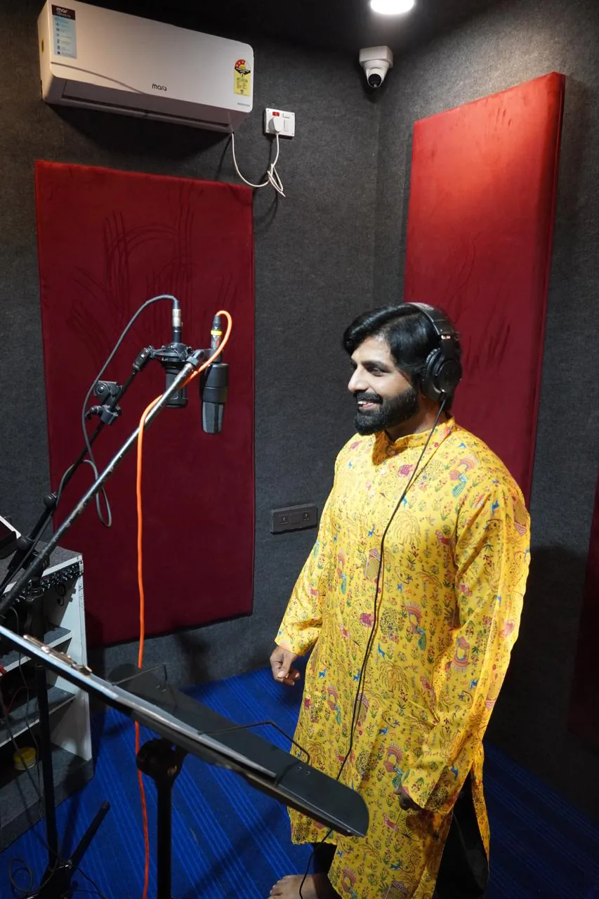 Full portrait of a smiling vocalist during a recording session at CloudStudio108